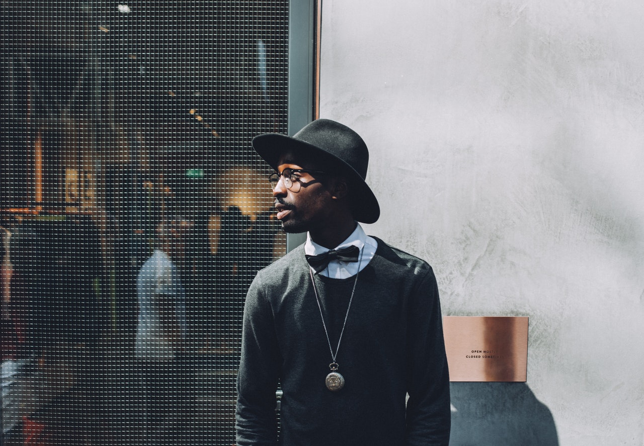 African American Man Wearing Black Clothes and Hat